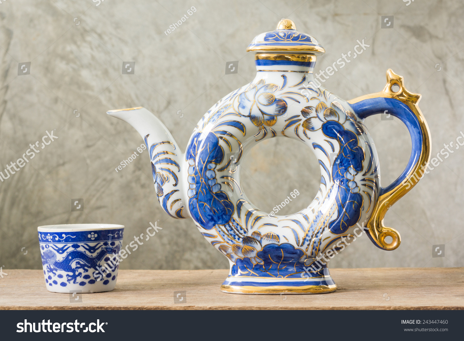 Blue and white Asian teapot with teacup