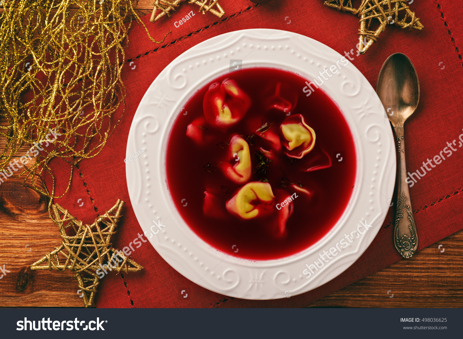 traditional polish christmas soup red borscht soup with dumplings on white plate - Polish Christmas Traditions traditional polish christmas soup red borscht soup with dumplings on white plate - Polish Christmas Traditions