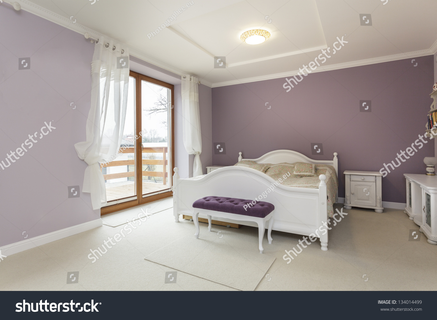 Tuscany Interior Purple Bedroom White Furniture Stock Photo