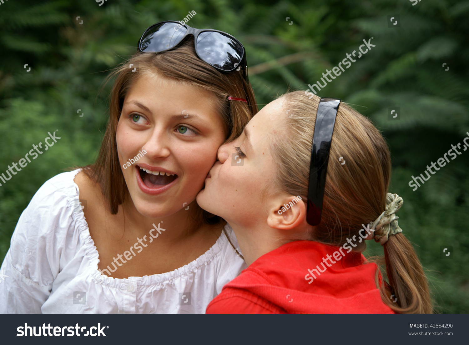 Two Beautiful Cheerful Teenage Girls KissingẢnh Có Sẵn42854290 Shutterstock 