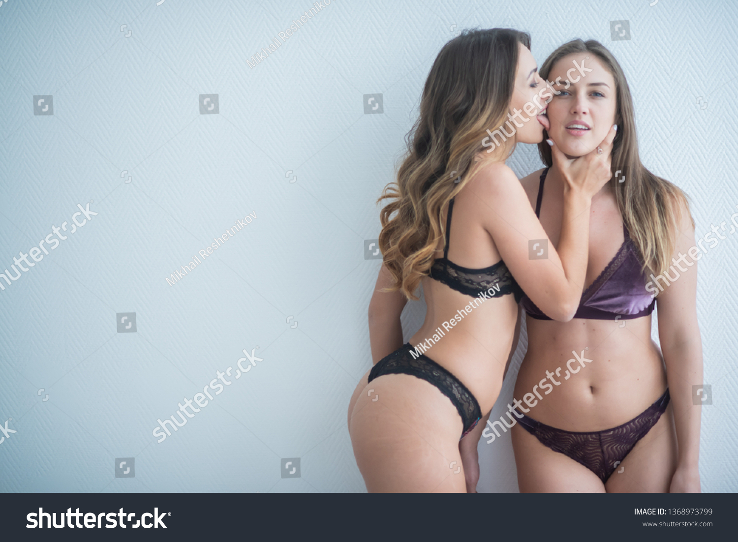 Lesbian kissing in lingerie