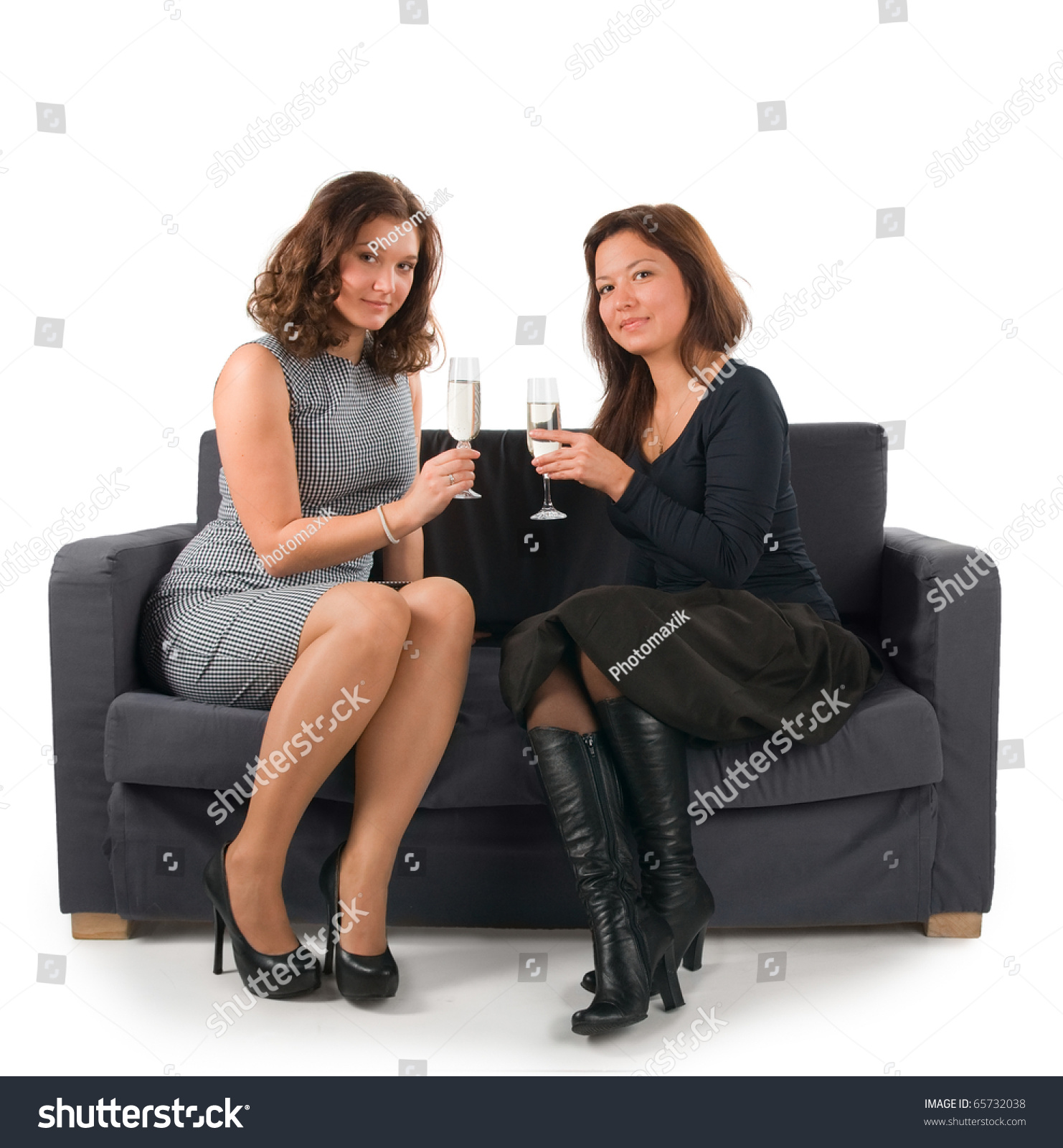 Two Beautiful Women Sitting On Sofa Stock Photo 65732038 - Shutterstock