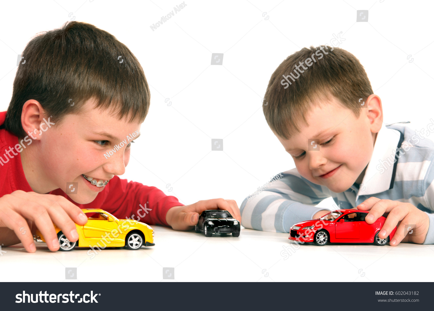 boys playing with cars