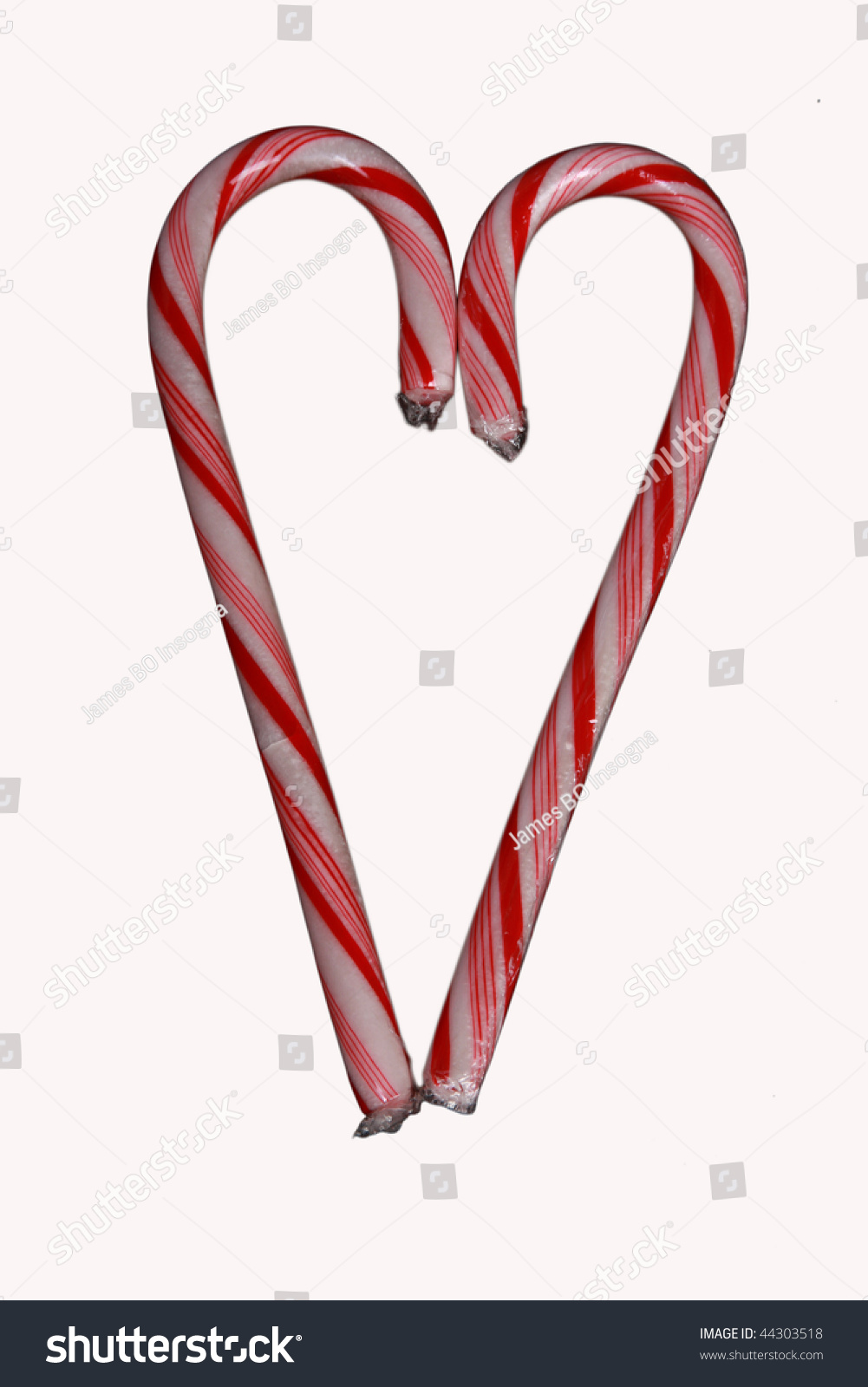 Two Candy Canes Put Together To Form A Heart Shape. Isolated On White ...