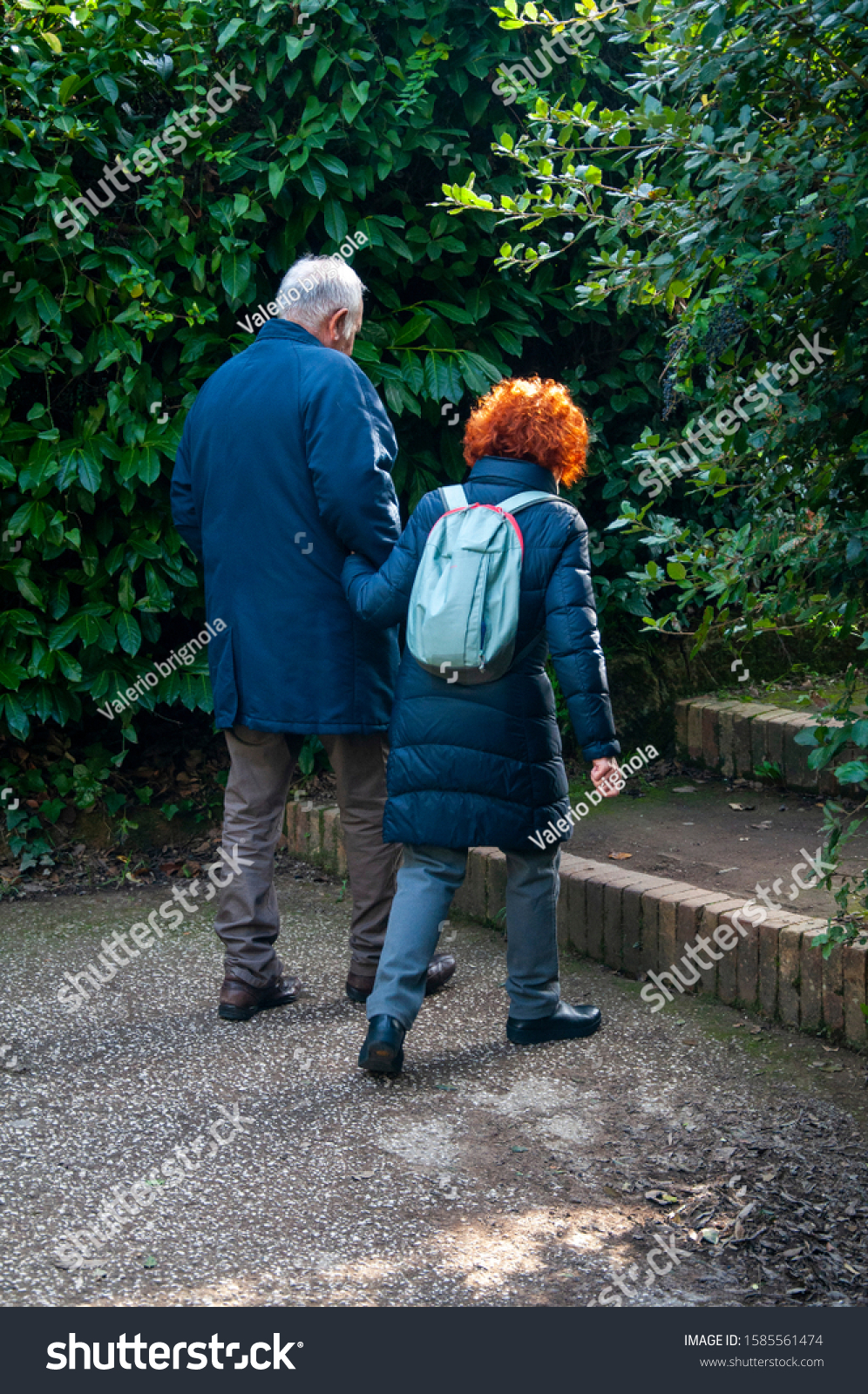 Two Elderly People Arm Arm Stroll Stock Photo Edit Now