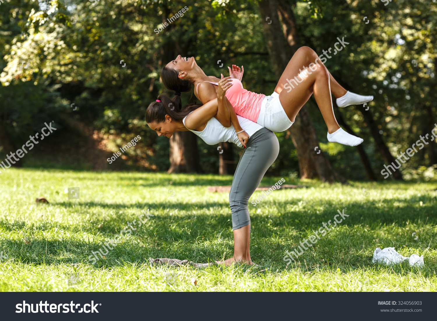 Two Female Friends Stretching Back Laughing Stock Photo (Edit Now ...