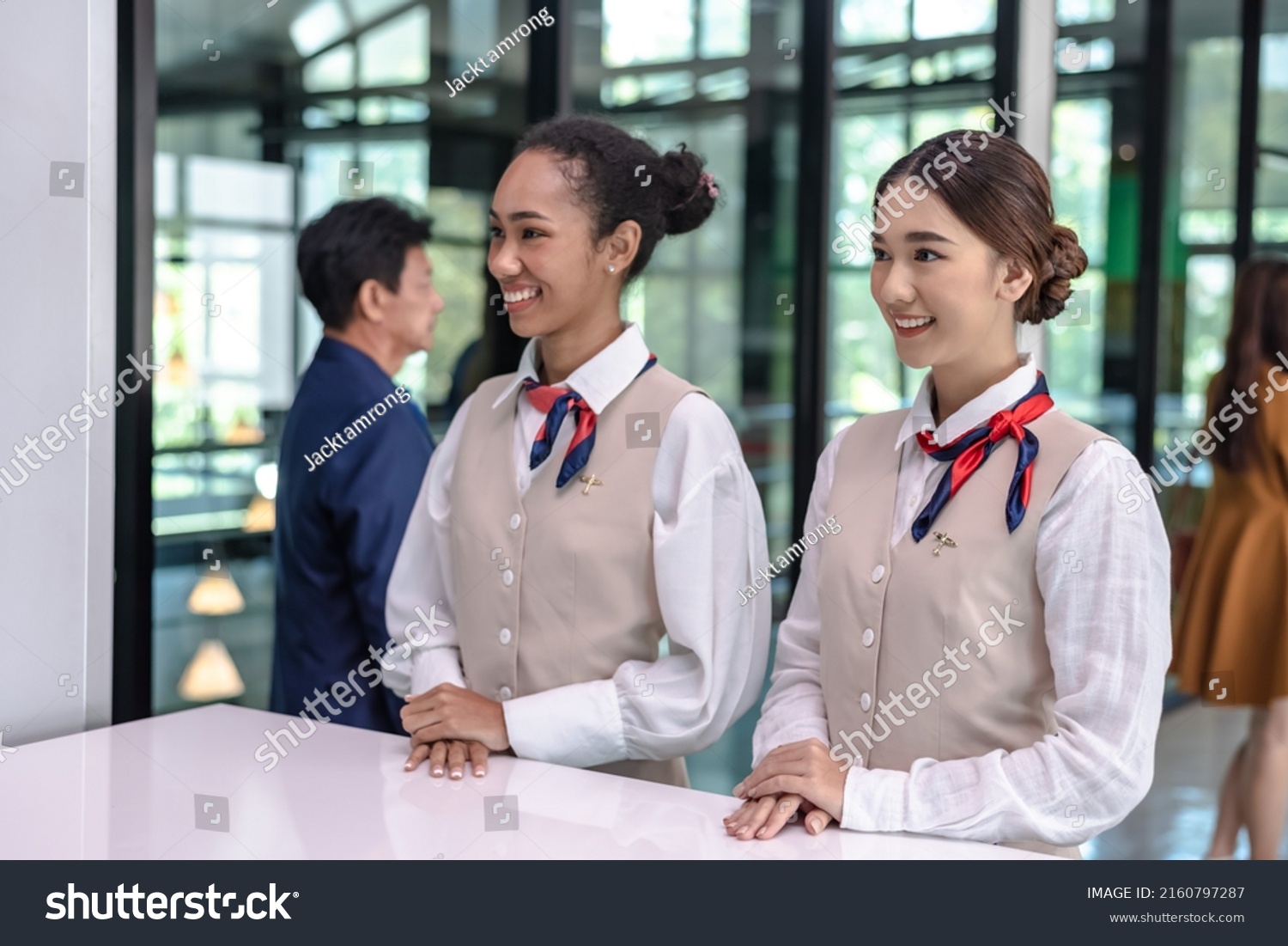 two-friendly-female-airport-ground-staffs-stock-photo-2160797287