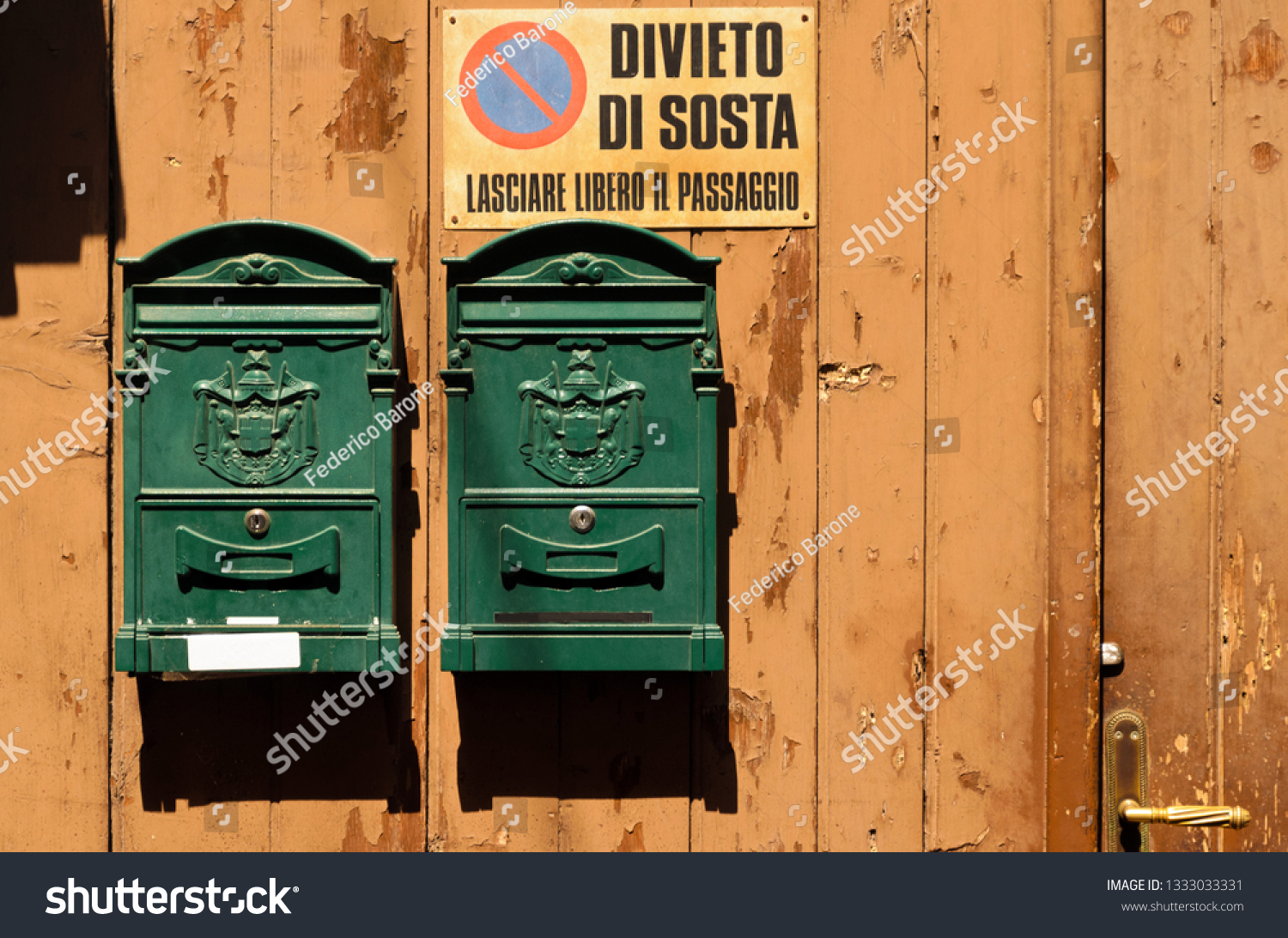 stock-photo-two-green-mailboxes-on-a-woo