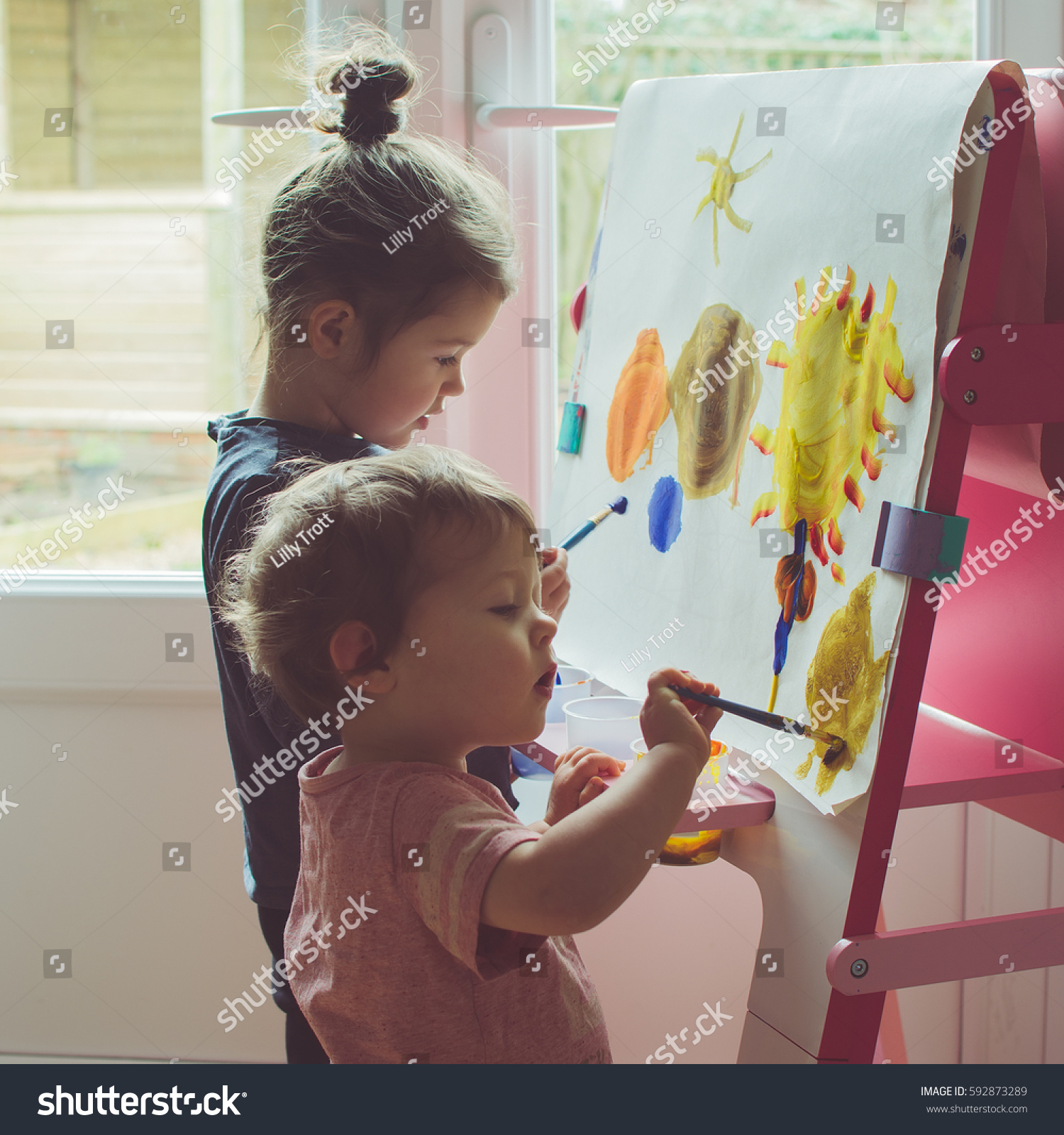 6 683 Child Painting Easel Images Stock Photos Vectors Shutterstock   Stock Photo Two Little Girls Painting On The Easel Selective Focus Toned 592873289 