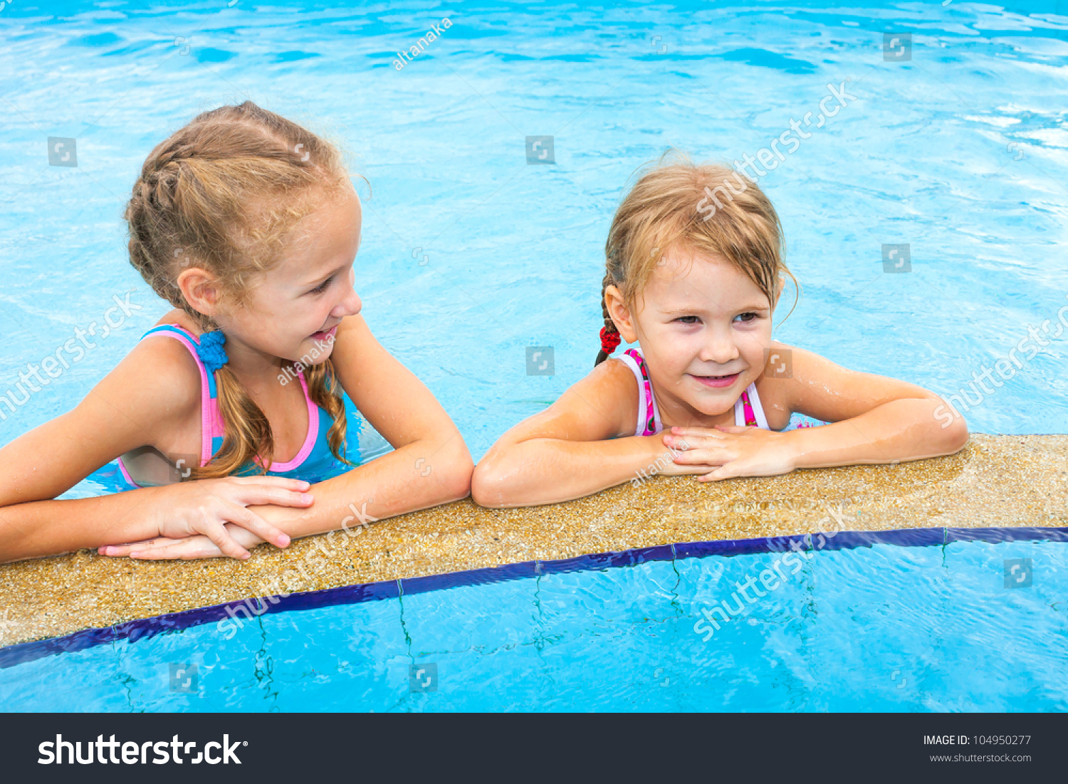 Two Little Girls Playing In The Pool Stock Photo 104950277 : Shutterstock