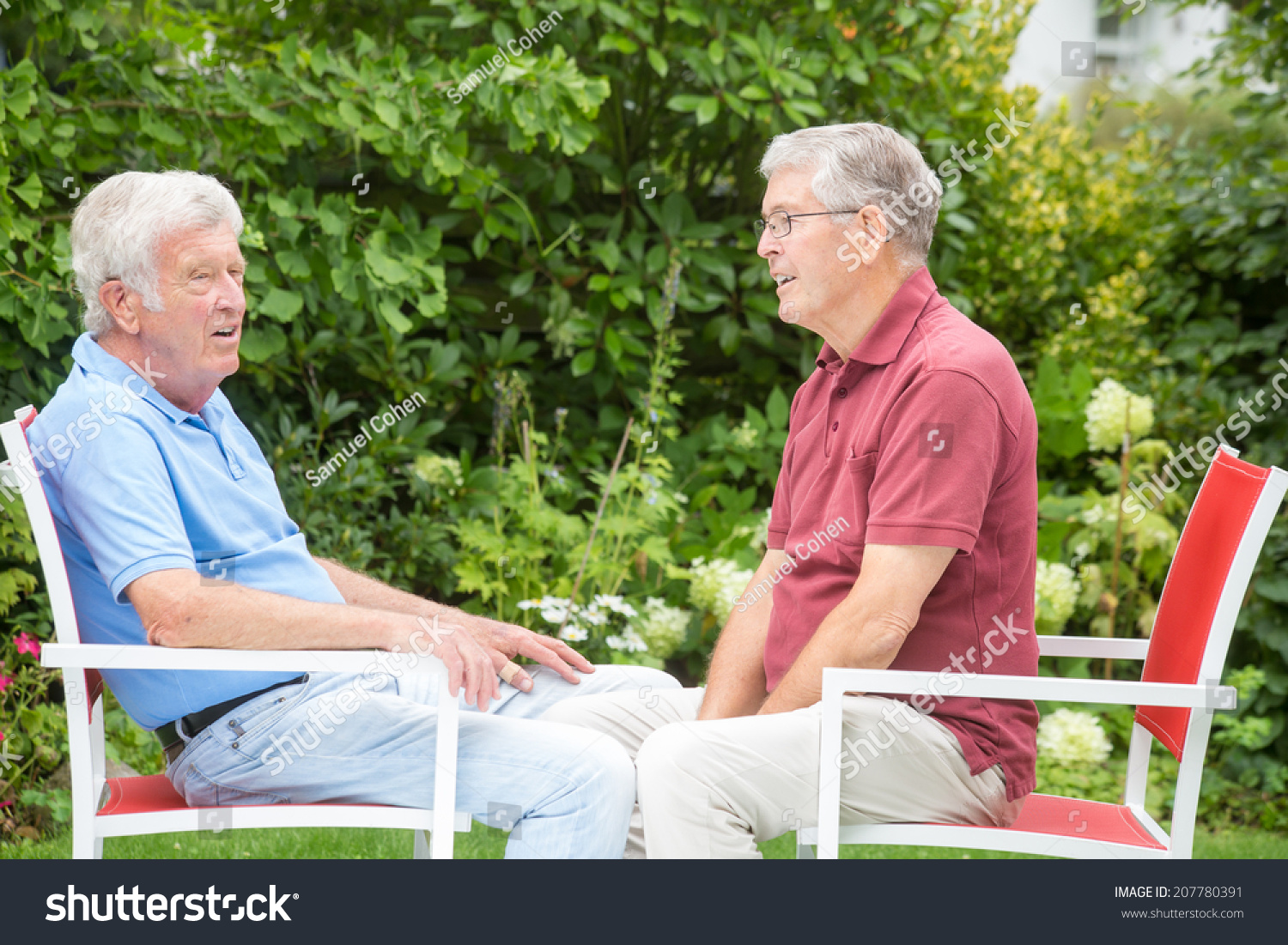 two-men-sitting-opposite-each-other-stock-photo-207780391-shutterstock