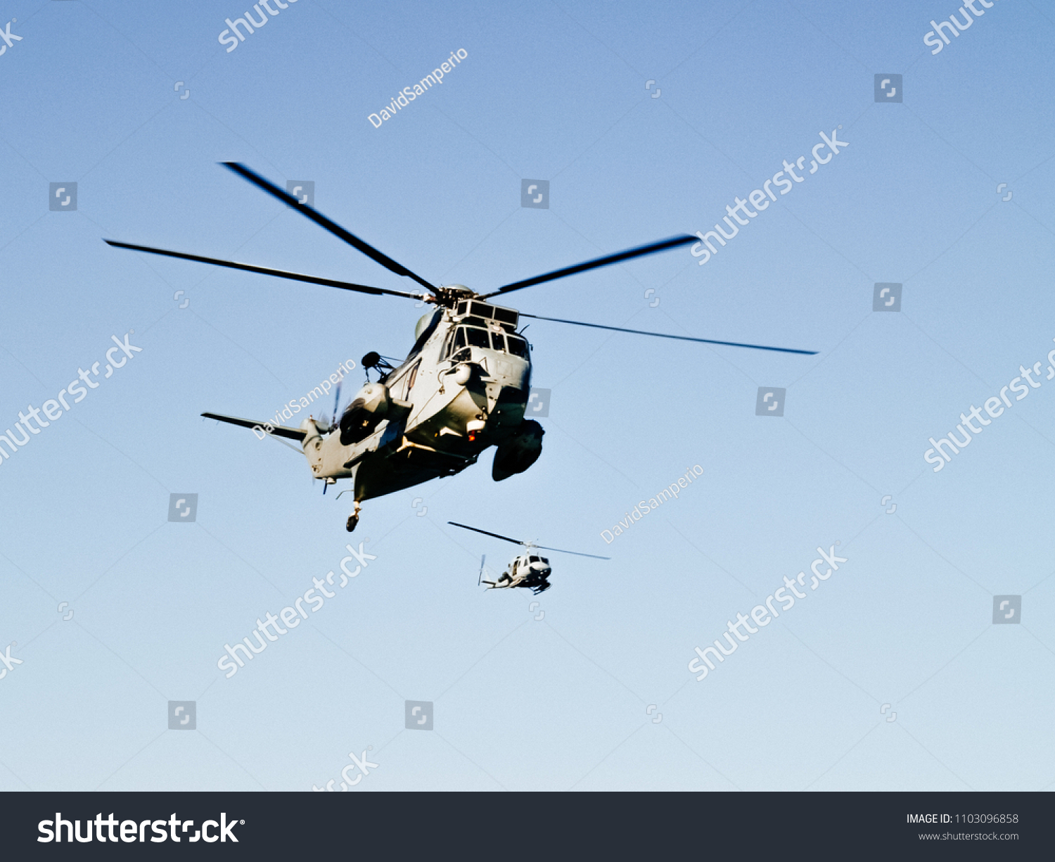 Two Military Helicopters Flying Together Stock Photo (Edit Now) 1103096858