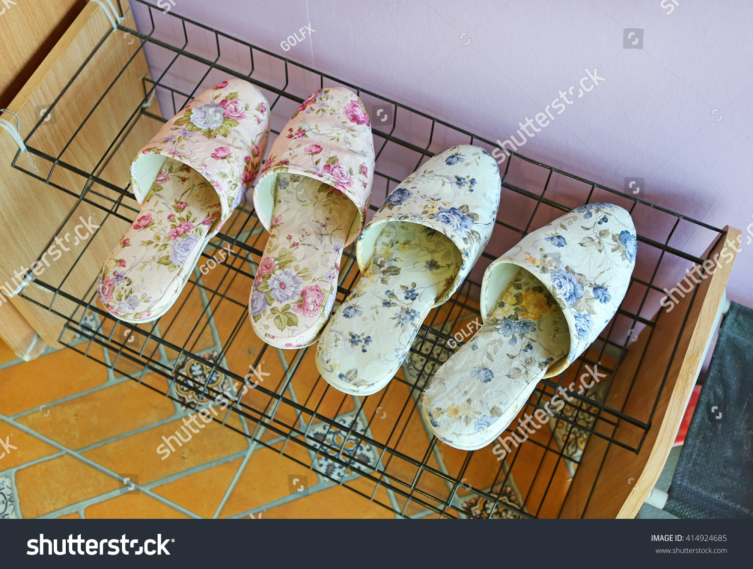 Two Pairs Slippers On Shoe Rack Stock Photo Edit Now 414924685