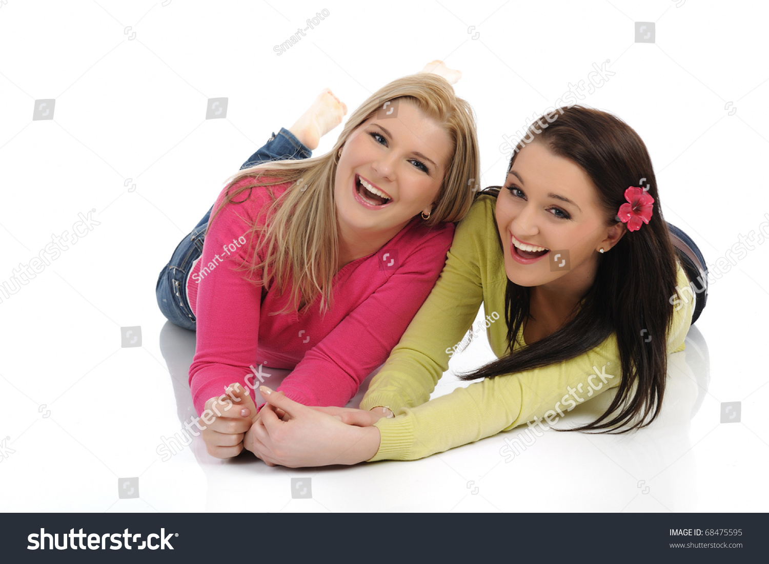 Two Pretty Girl Friends Having Fun And Laughing On The Floor. Isolated ...