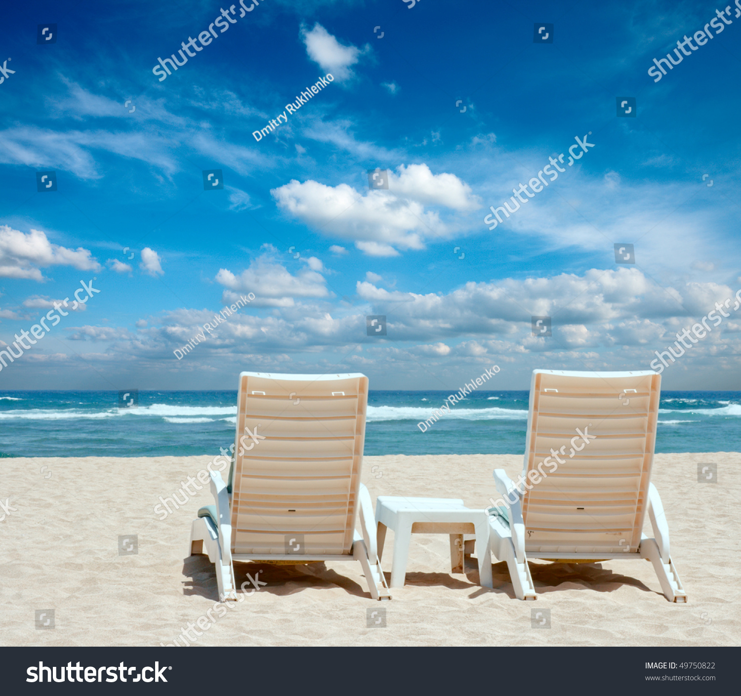 Two Sun Beach Chairs On Shore Stock Photo 49750822 - Shutterstock