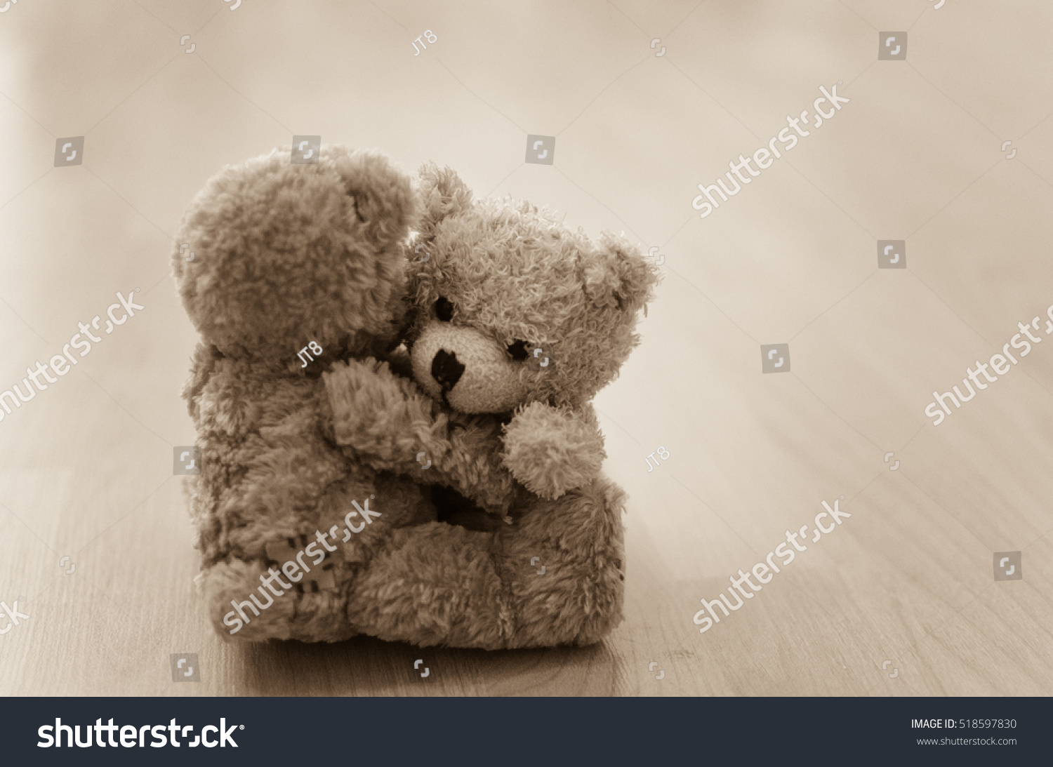 two teddies hugging