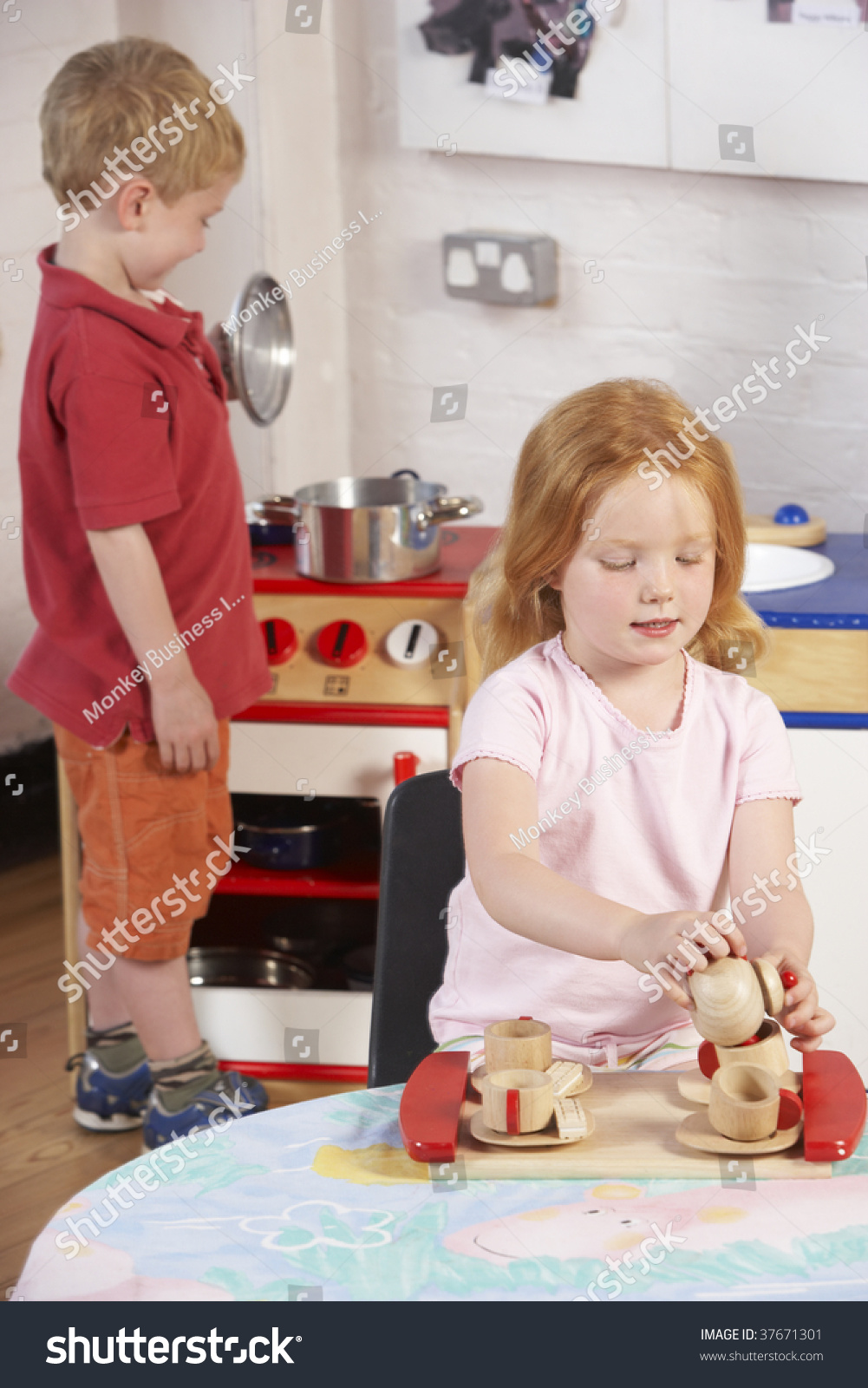 Two Young Children Playing Together Montessoripreschool Stock Photo