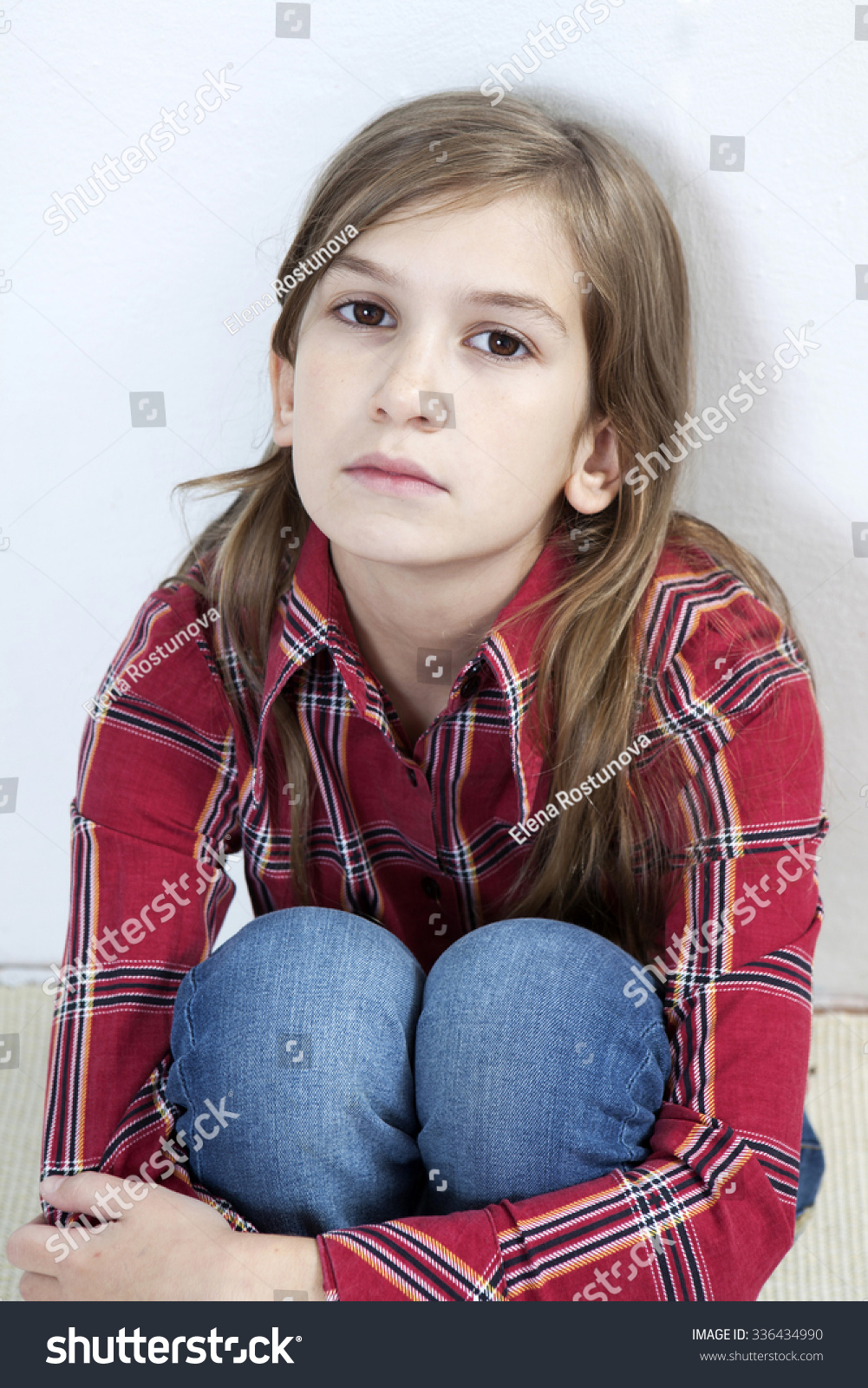 Unhappy Little Girl Sitting On Carpet Stock Photo 336434990 | Shutterstock