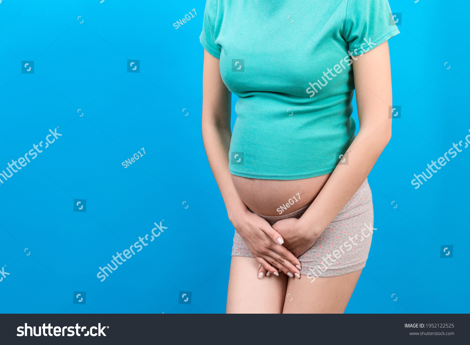 urinary-incontinence-during-pregnancy-abdominal-pain-stock-photo