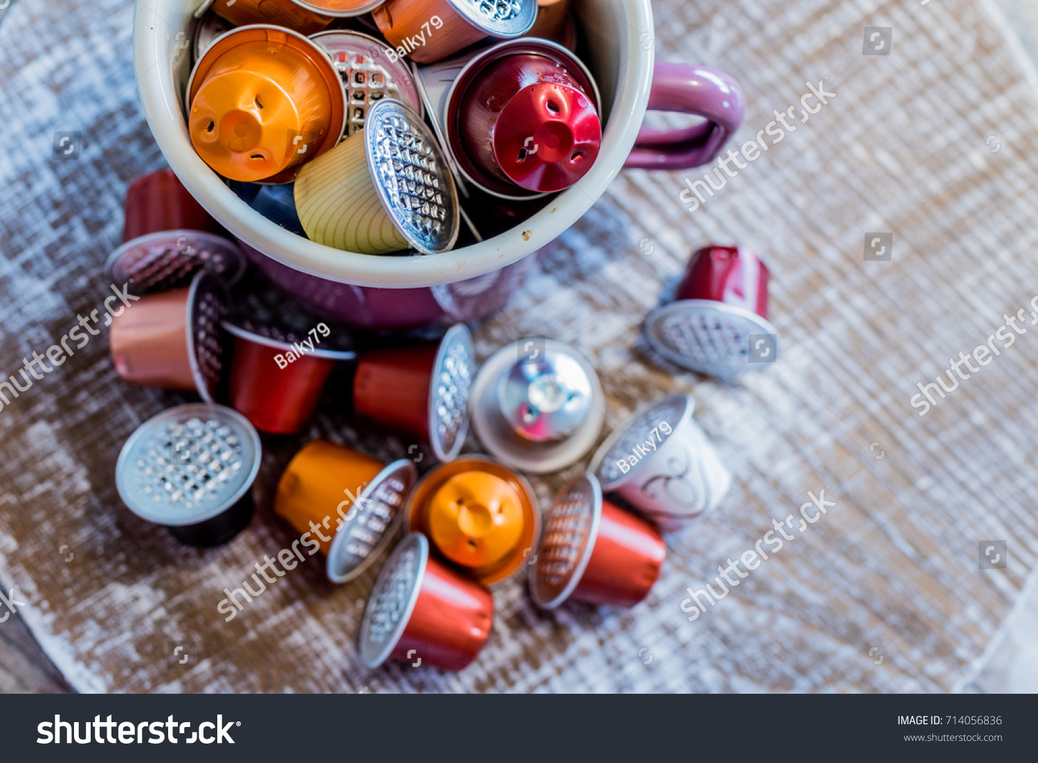 Used Coffee Pods In Enamel Mugs Against Wooden Background Used Coffee Pods In Enamel Mugs Against Wooden Background