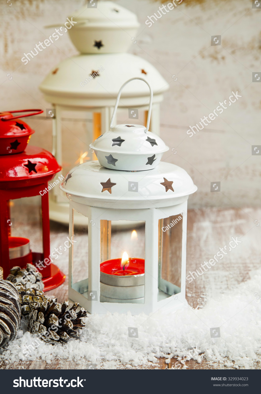 Vintage Christmas Lanterns With Candles In The Snow On Wooden Table ...