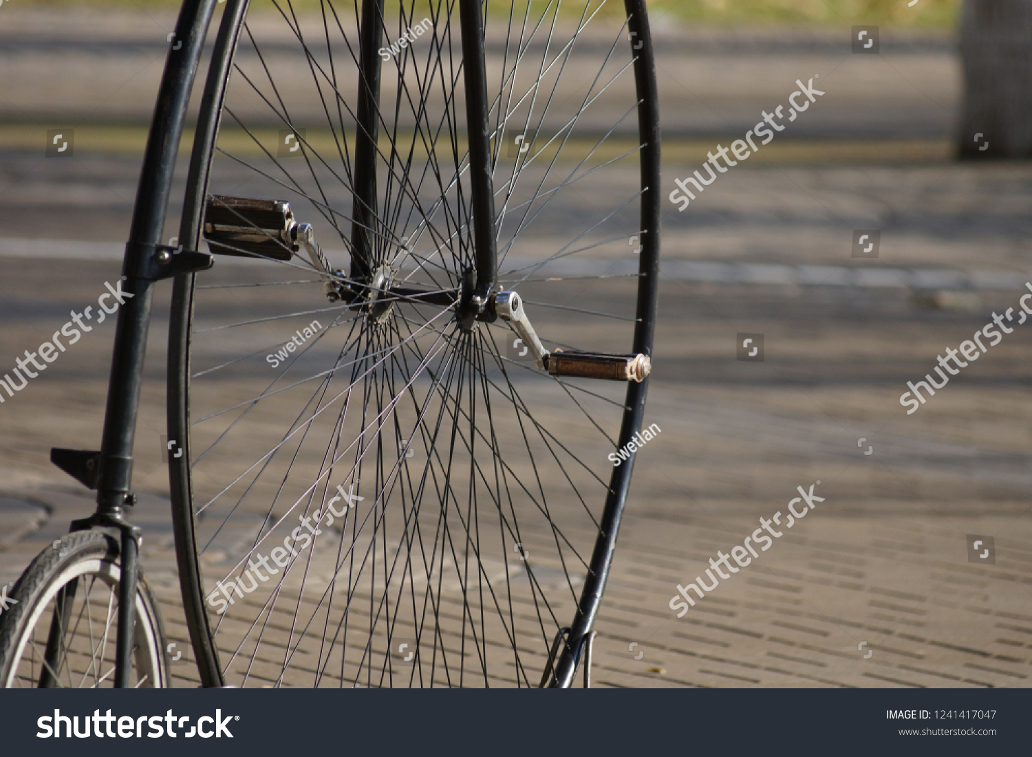 old bicycle with big front wheel