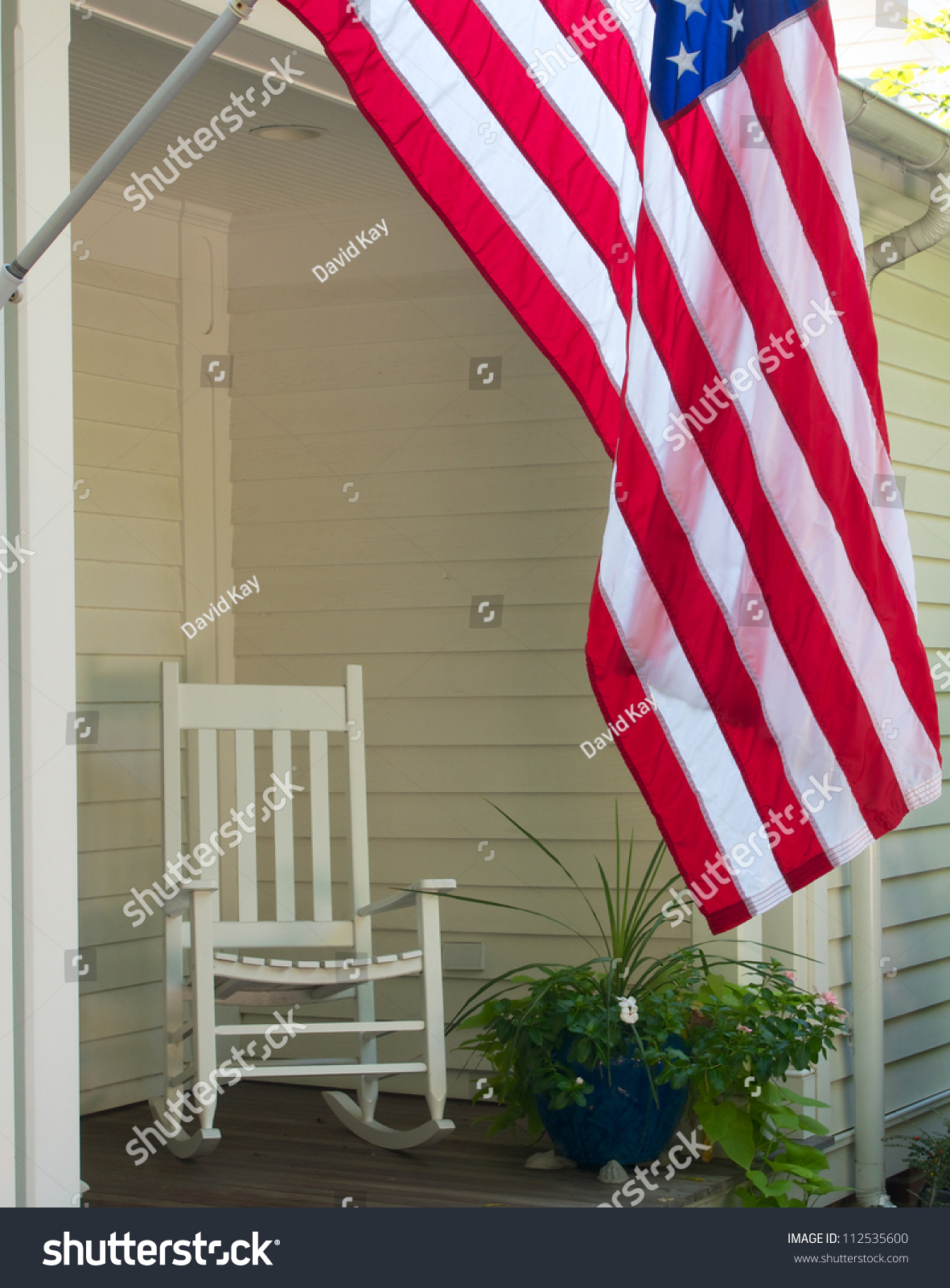 Vintage Scene Of Rocking Chair And Us Flag On Front Porch Stock Photo ...