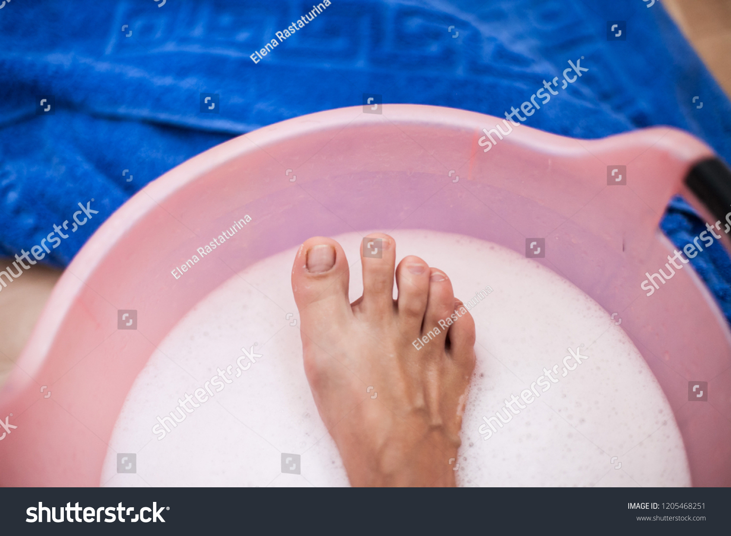 washing feet in bathroom sink