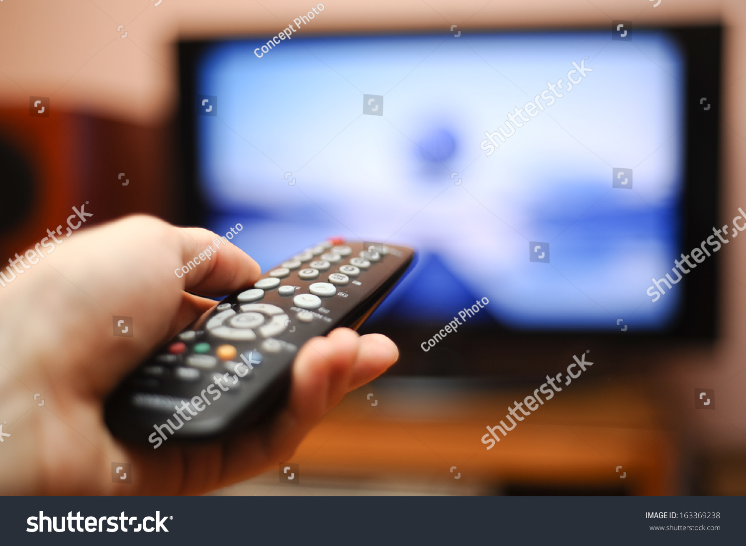 34,830 Watching tv remote control Stock Photos, Images & Photography ...