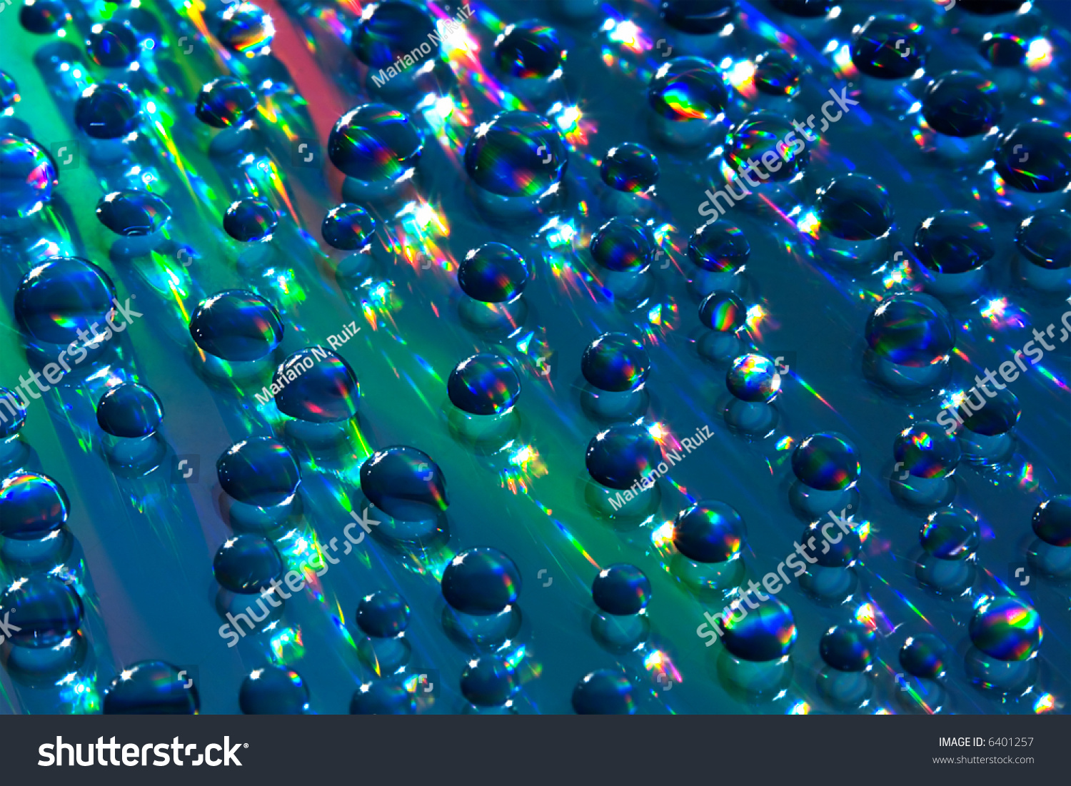 Water Drops On Reflective Surface. Hard Lighting Produces Rainbow-Like ...