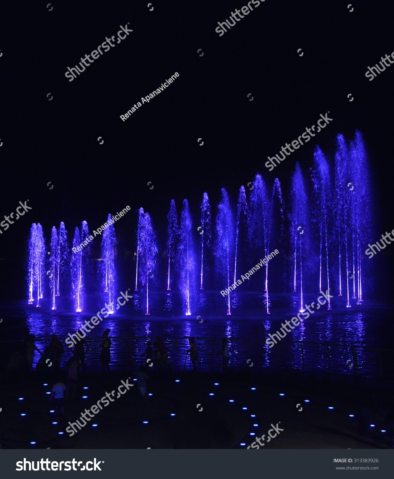 Water Fountains On Night Background In Smart City Malta. Dancing Water ...