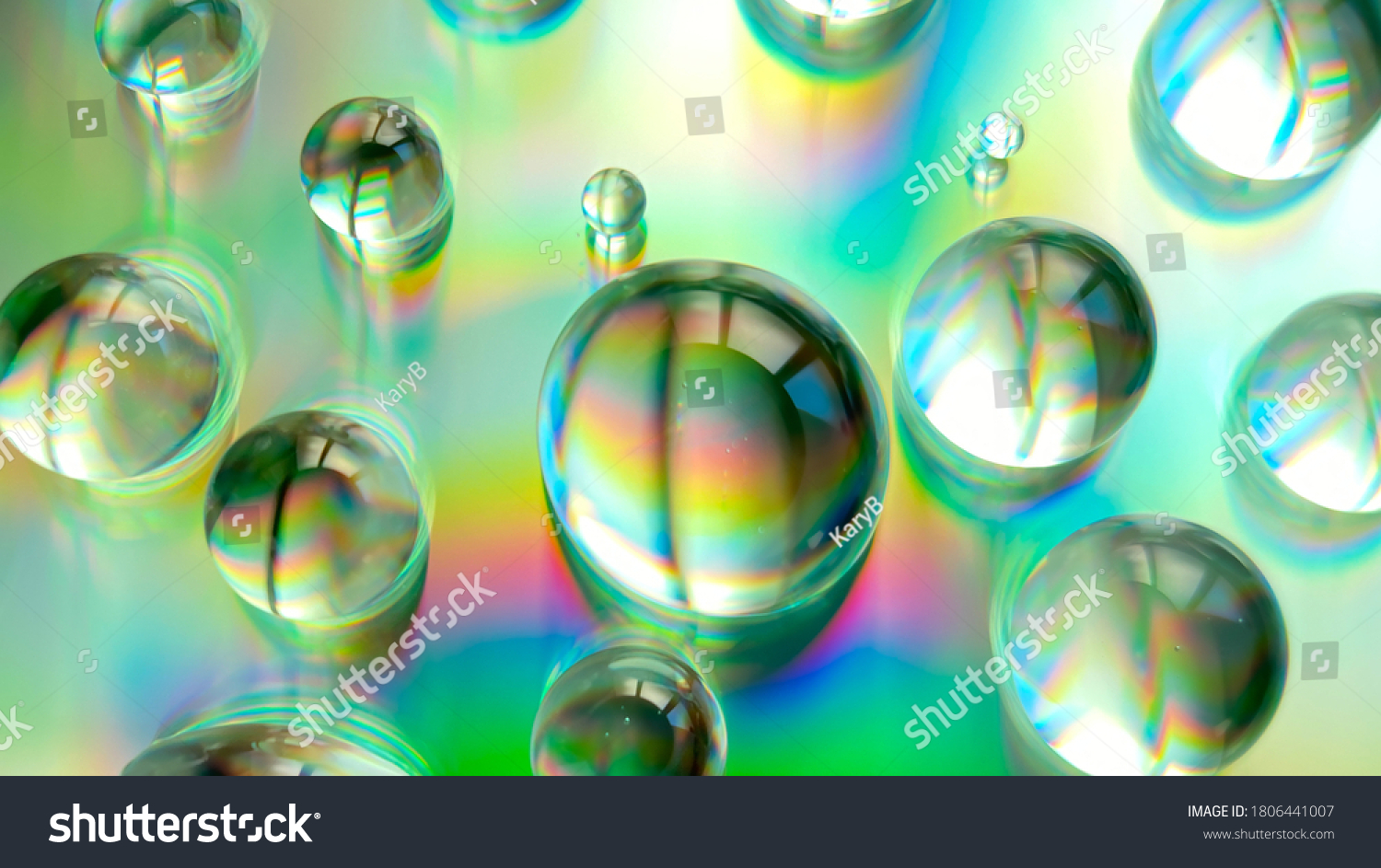 Water Glycerine Drops On Rainbow Backdrop Stock Photo 1806441007 ...