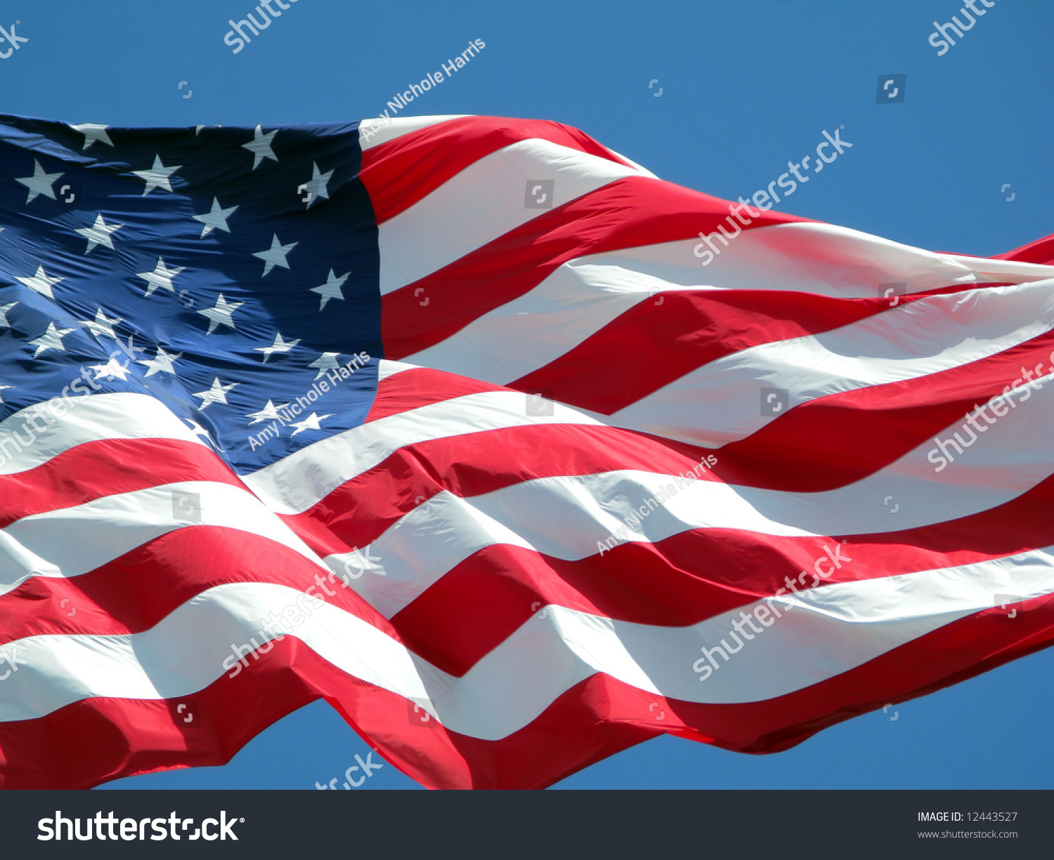 Waving American Flag Against A Blue Sky Background. Stock Photo ...