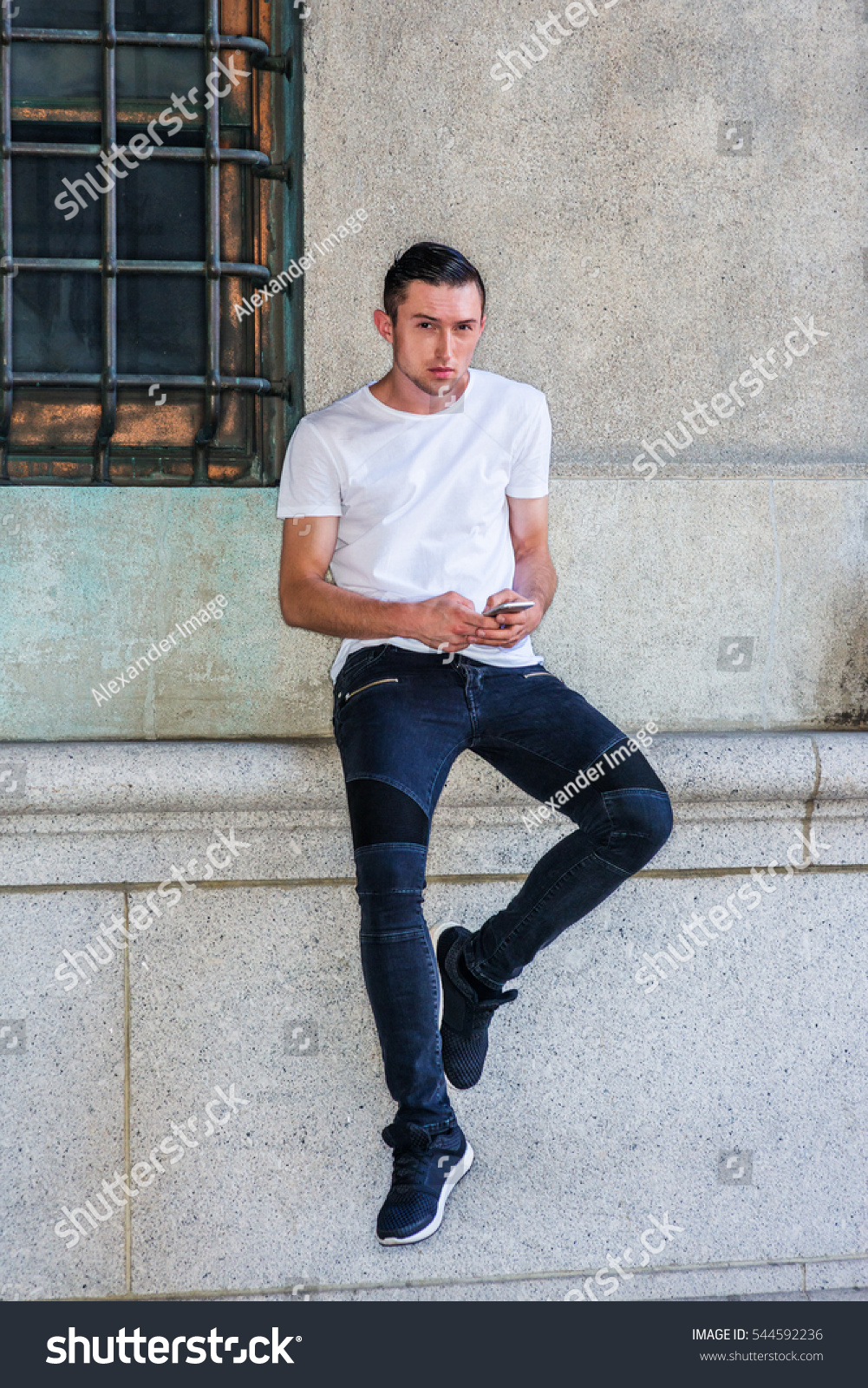 white shirt jeans and sneakers