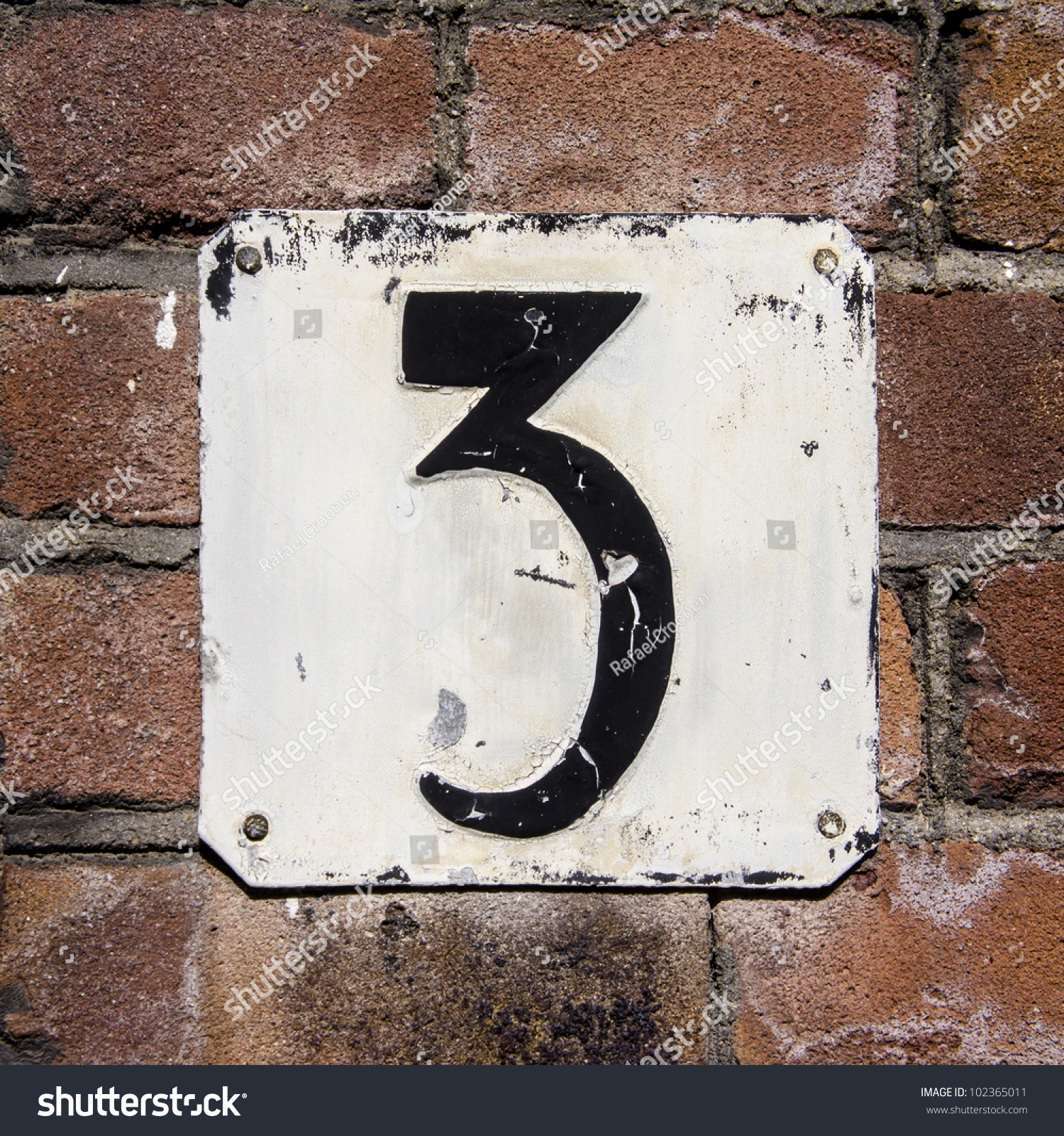 Weathered And Crackled House Number Three On A Brick Wall Stock Photo ...