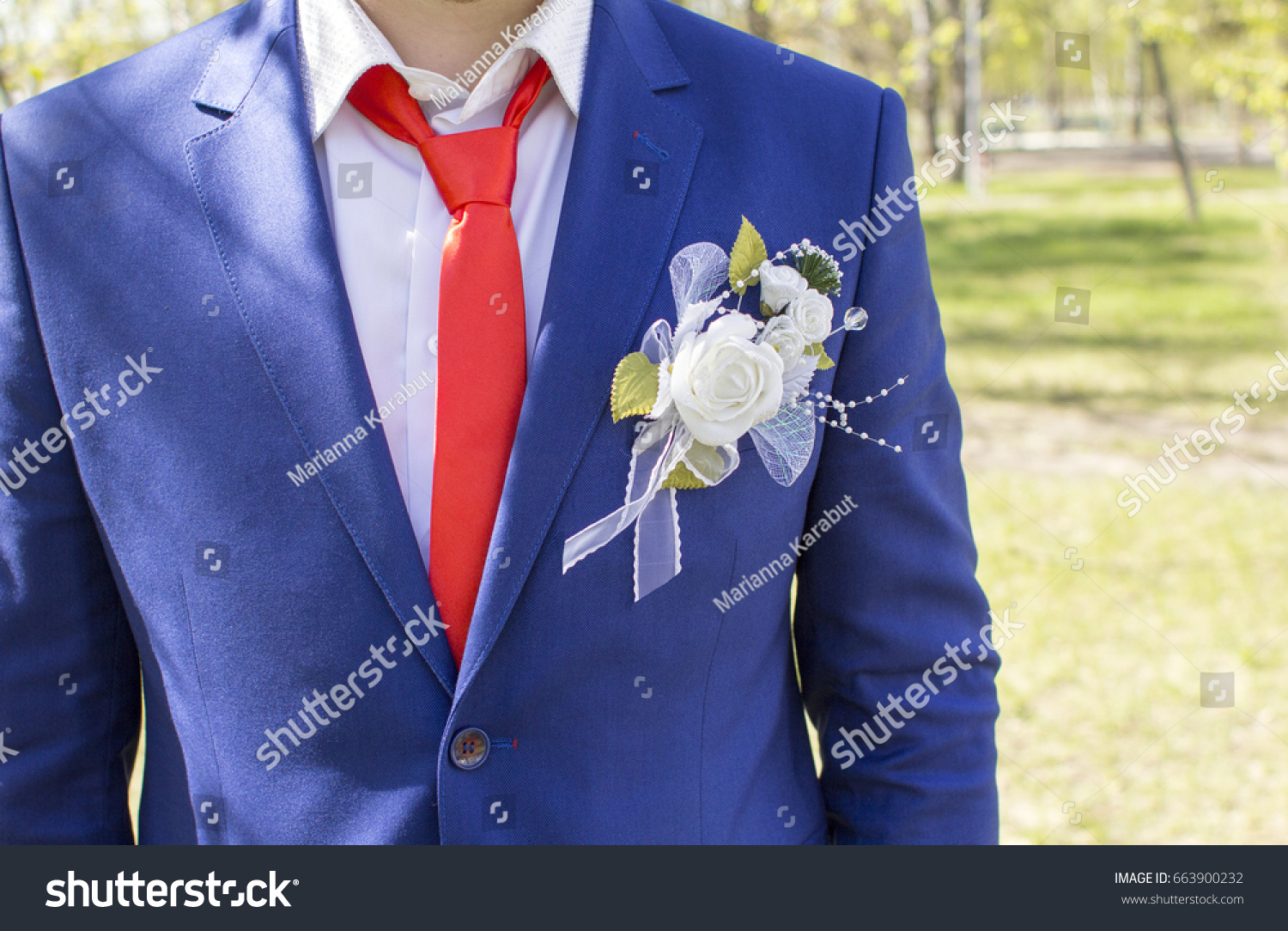 blue blazer and red tie