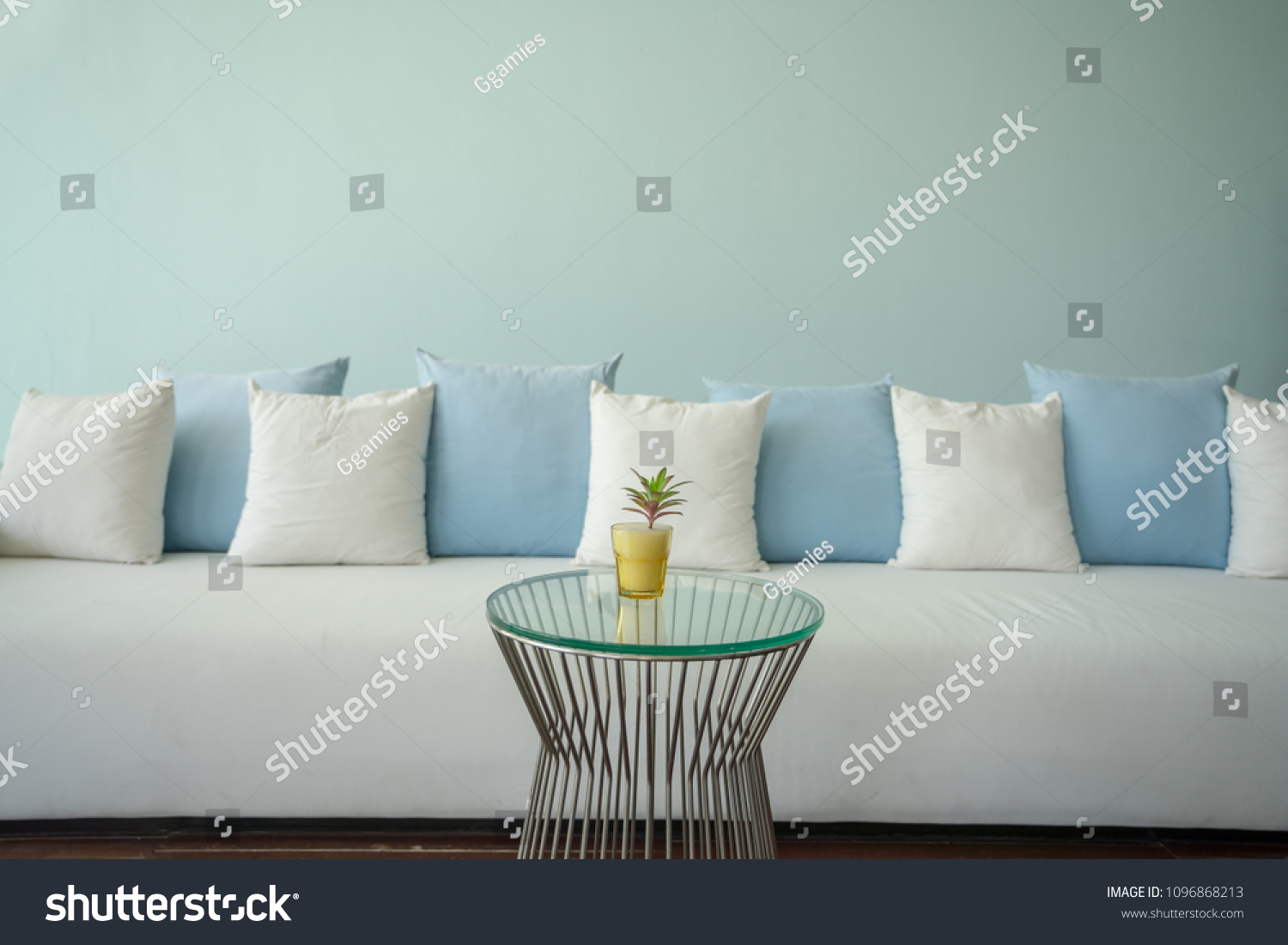 white couch blue pillows