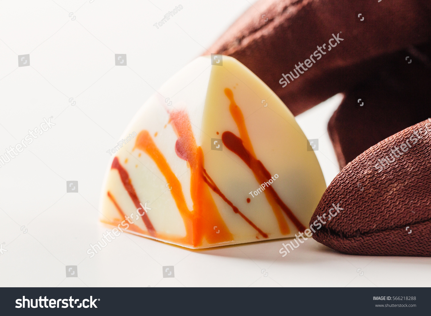 https://www.shutterstock.com/image-photo/white-chocolate-handmade-candy-orange-splashes-566218288
