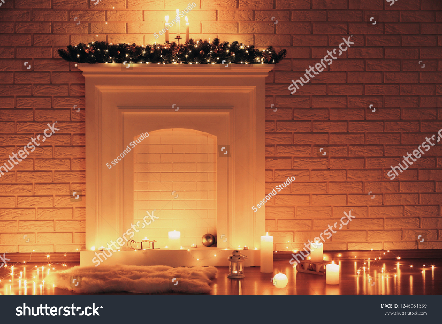 White Decorated Fireplace Candles On Brick Stock Photo Edit Now