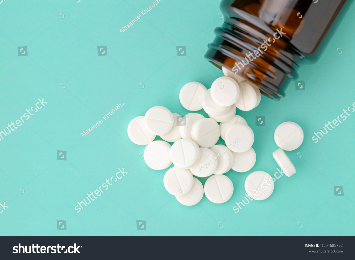 white-round-tablets-scattered-front-glass-stock-photo-1504685792