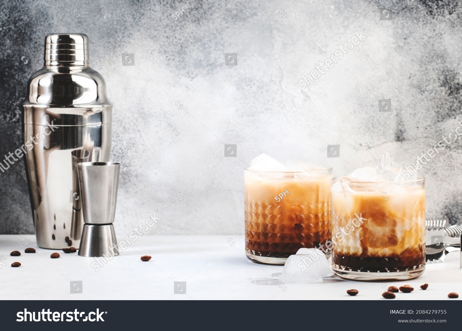 Stock Photo White Russian Cocktail Trendy Alcoholic Drink With Vodka Coffee Liqueur Cream And Ice Gray 2084279755 