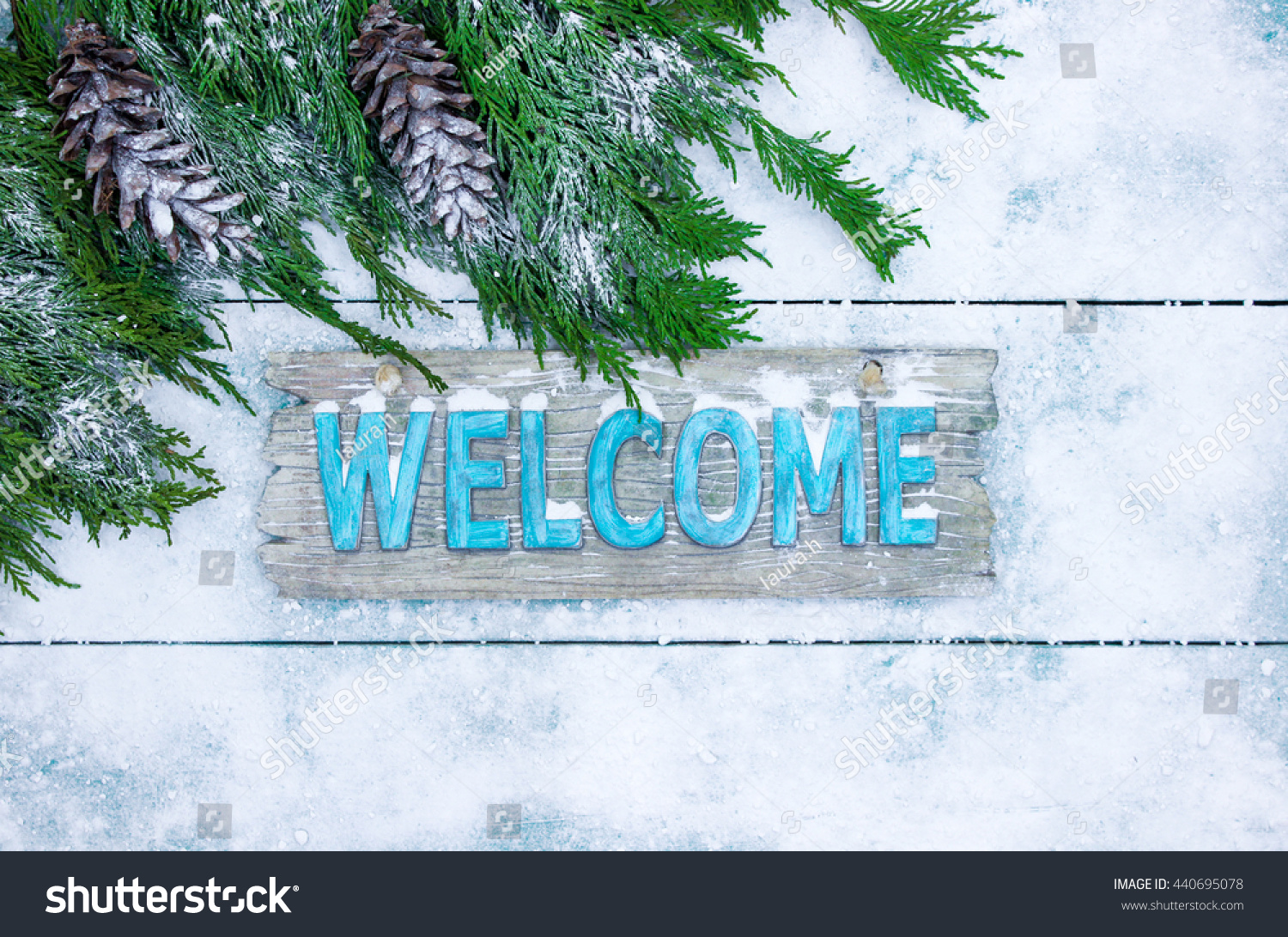 Winter Welcome Sign With Tree Branch And Pine Cones Border On Teal Blue ...