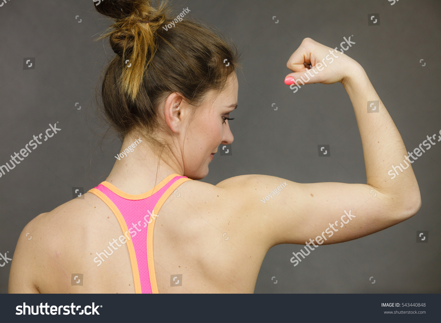 Young girls showing muscles have kept Young girls showing muscles