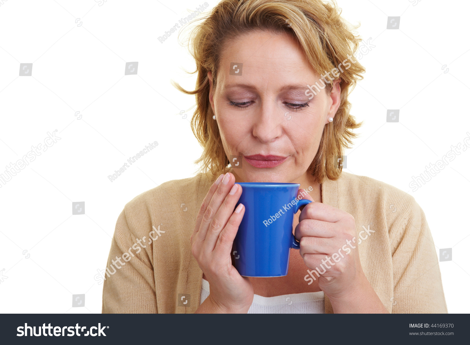 Woman Blowing Cool Air In Her Cup Of Tea Stock Photo 44169370 ...