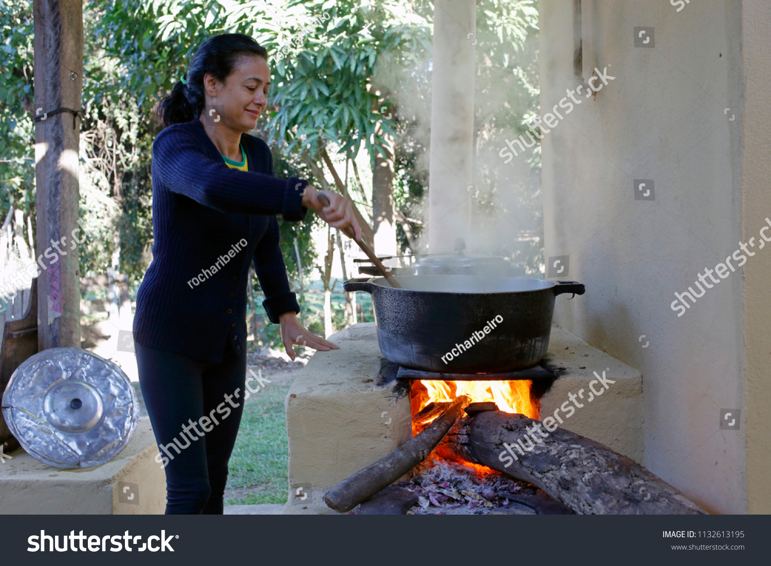 Woman Cooking Rice On Stove Wood Stock Photo Edit Now 1132613195