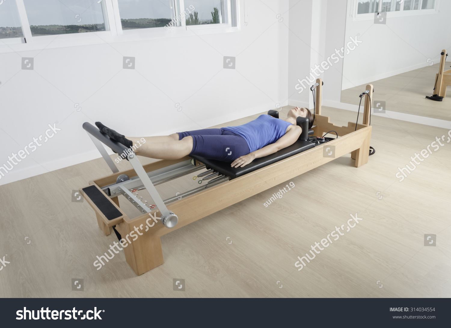 Woman Doing Exercise Pilates Reformer Bed Stock Photo Shutterstock