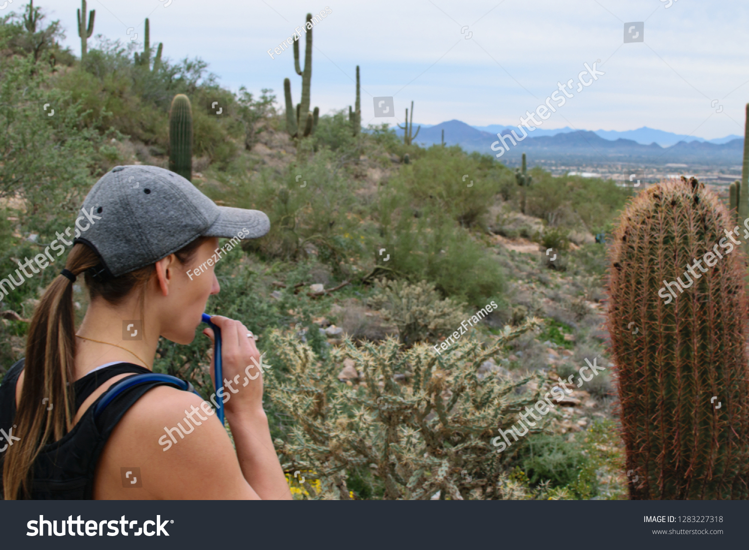 Woman Drinking Water Next Cactus Stock Photo Edit Now 1283227318