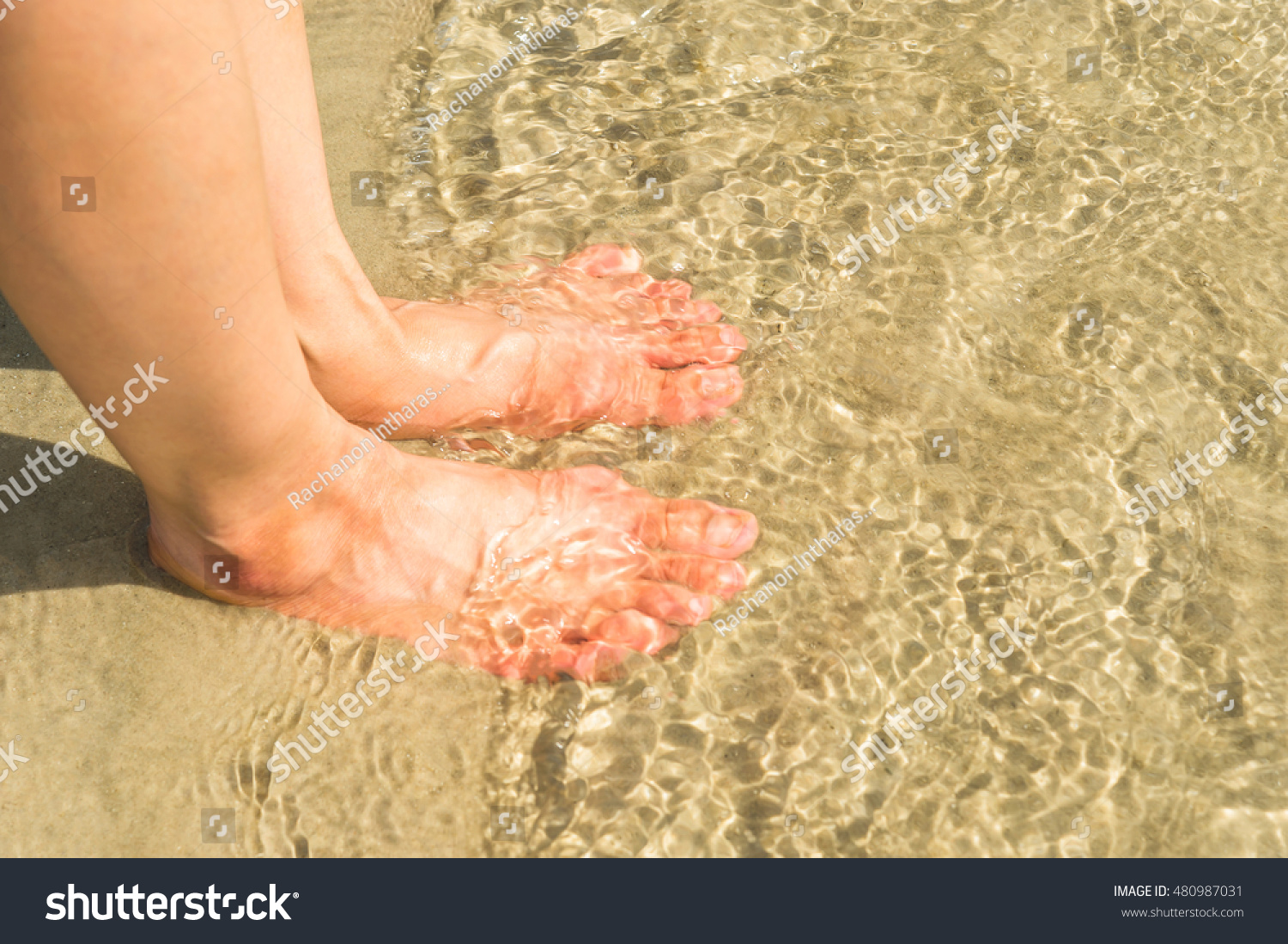 woman-feet-water-on-beach-stock-photo-edit-now-480987031