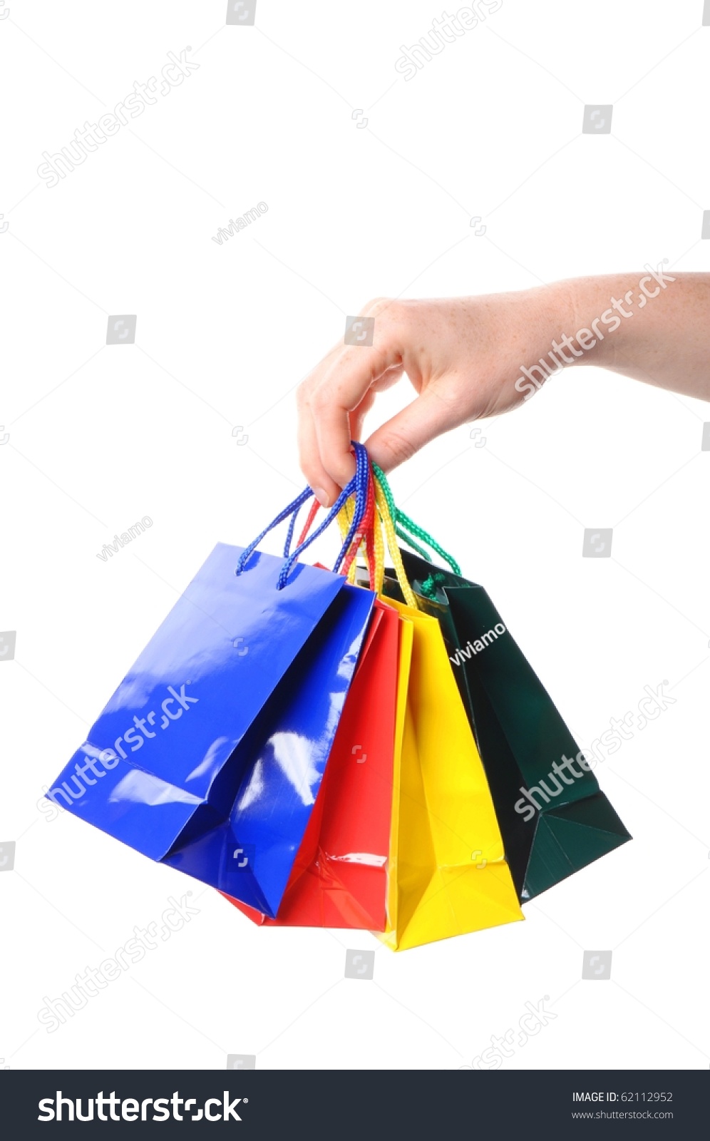 Woman Hand Carrying A Bunch Of Colored Shopping Bags Isolated On White ...