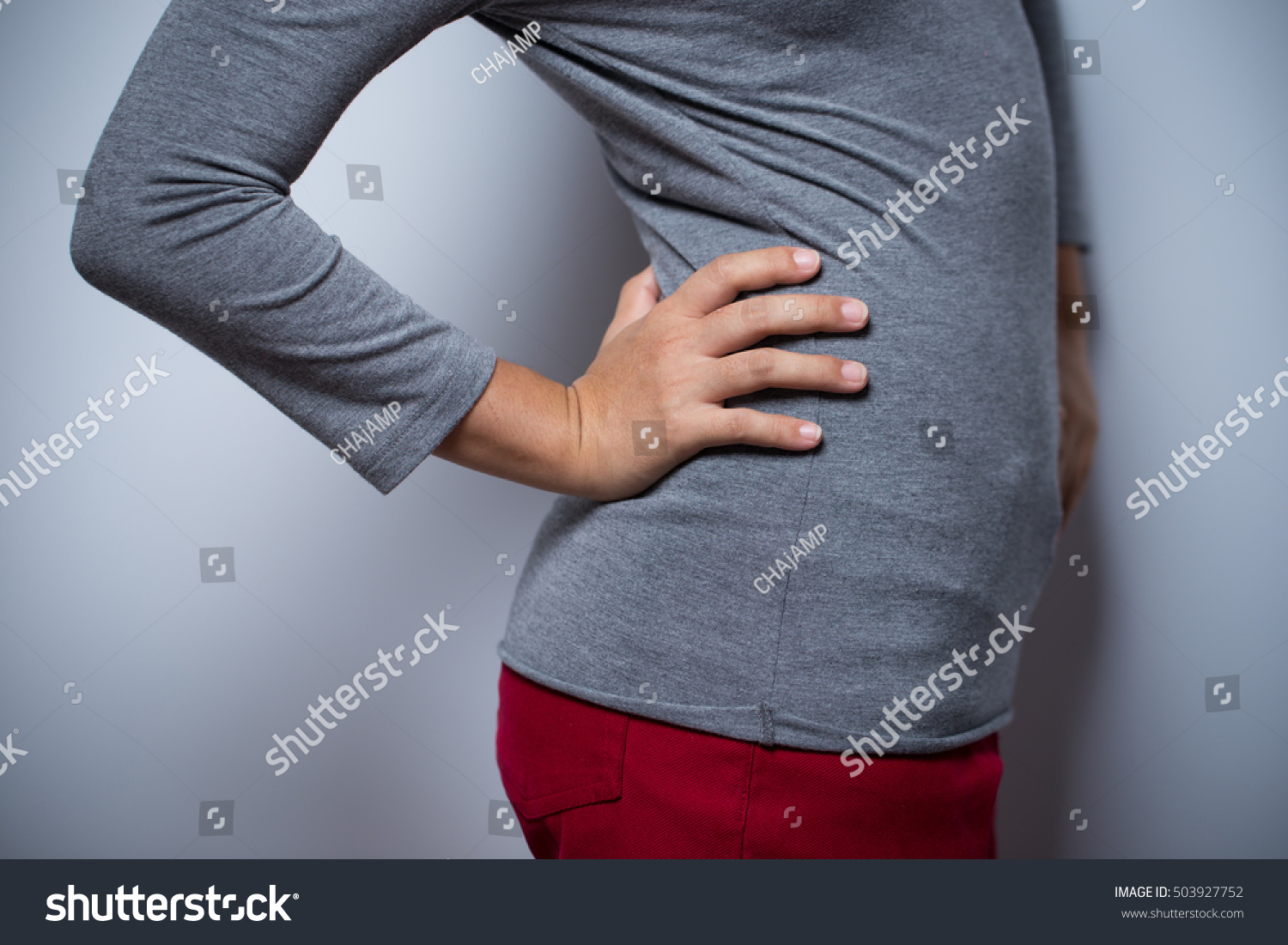 woman-has-waist-pain-stock-photo-503927752-shutterstock